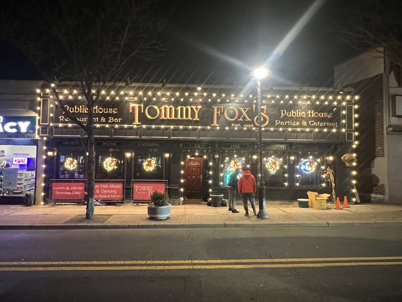 Storefront lit up for the holidays